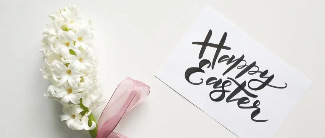 Happy Easter Card Next to Flower